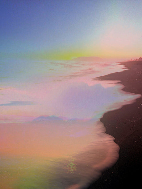 LOVE IS STRONGER THAN PRIDE: The serene beauty of a sunrise over a coastal shoreline. The sky is awash in soft hues of pink, purple, and yellow, creating a dreamy and ethereal atmosphere. The shoreline, with its dark sand and gentle waves, blends seamlessly with the mist and the horizon, creating a sense of peace and tranquility.