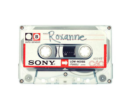 ROXANNE: A close-up image of a vintage Sony C60 audio cassette tape. The cassette is white with a red and black Sony logo. The cassette has a handwritten label that reads Roxanne in black marker.