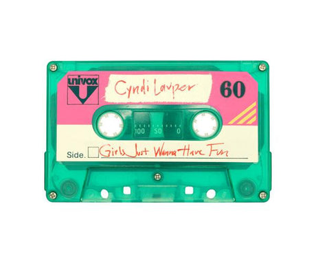 GIRLS JUST WANNA HAVE FUN: This is a close-up image of a vintage green cassette tape. The cassette is labelled with Cyndi Laupers 1983 hit Girls Just Want to Have Fun. The cassette is in mint condition and has a 60-minute capacity.