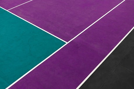 WAWRINKA: A close-up, aerial view of a tennis court with purple, teal, and black lines. The lines are white and form a geometric pattern across the court. The image is taken during the day.