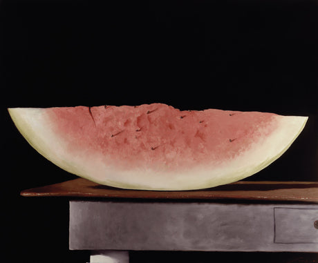 MEZZA LUNA: A still life painting depicts a slice of watermelon on a wooden table. The watermelon is sliced open, revealing the red flesh and black seeds. The background is a dark, muted color, providing a stark contrast to the vibrant watermelon. The image captures the simple beauty of everyday objects and evokes a sense of calm and serenity.