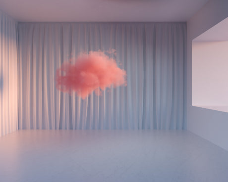 PINK CLOUD: A single, pink cloud floats in the middle of a room with white curtains and a blank window. The room has a minimalist design with white walls and a light grey floor. The cloud appears to be floating in front of the curtains, creating a surreal and dreamlike atmosphere.