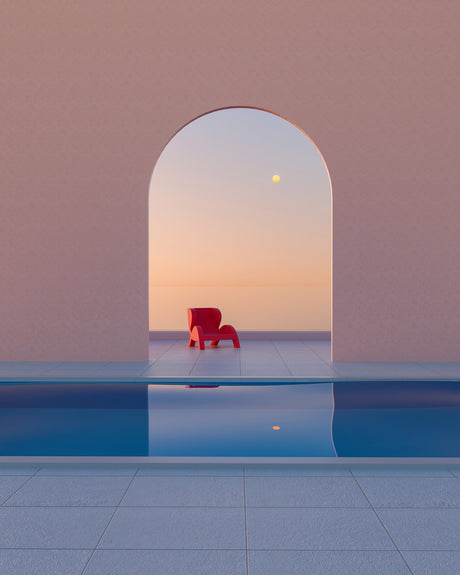 SUNSET VERSION 2: A single red chair sits by a swimming pool, looking out toward the sunset visible through an arched doorway. The image is simple and minimalist, with a soft color palette. The scene is serene and inviting, suggesting a moment of peace and tranquility.