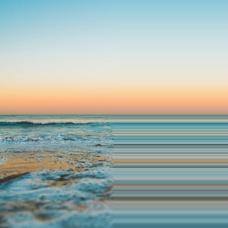 YOU COULD FEEL THE SKY: A panoramic view of a tranquil ocean sunset with gentle waves crashing on a sandy beach. The sky is a beautiful blend of soft pink and blue hues, reflecting the setting sun. The waves are foamy and white, creating a sense of calm and serenity.