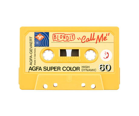 CALL ME: A yellow cassette tape labeled Agfa Super Color High Dynamic 60 featuring Blondies hit song Call Me. The tape is made in Germany and features a red phone icon. The tape is a popular item for music lovers and collectors.