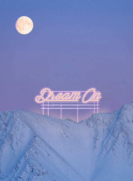 DREAM ON: A bright neon sign reading Dream On is illuminated against a twilight sky over a snow-covered mountain range. A full moon hangs in the sky, casting a soft glow over the landscape.