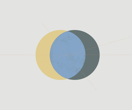 ECLIPSE 11: A digital illustration featuring three overlapping circles. The largest circle is blue, with a yellow circle partially overlapping it on the left side and a gray circle partially overlapping it on the right side. The background is white.