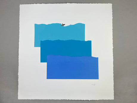 things COME in THREES: A minimalist abstract print featuring three blue rectangles arranged vertically, resembling waves. A small, white seagull is flying above the top rectangle. The print is on white paper and has a slight texture.